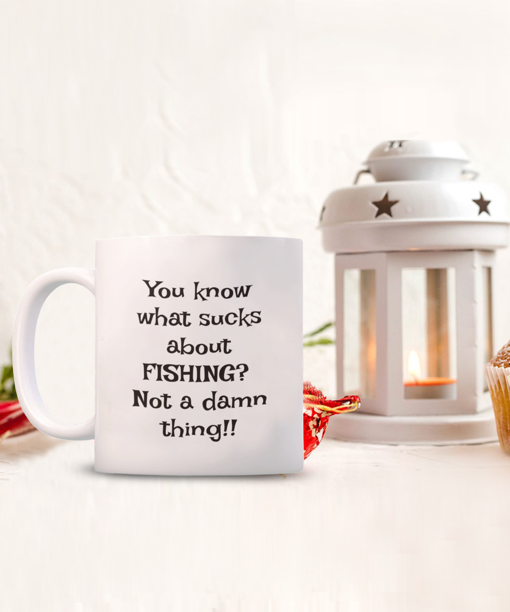 You know what sucks about FISHING? Not a damn thing!! 11oz mug, white, funny